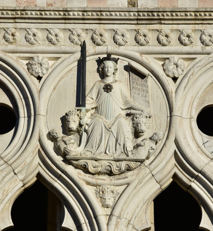 Detail from Doge's Palace western facade with the Goddess of Justiceのeditorial素材
