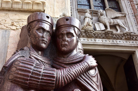 Detail from Monument of Four Tetrarchs and Porta della Carta, at the corner of Saint Mark Basilica in Venice, italyのeditorial素材