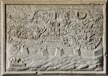 Stone panel with an ancient map of Rome from Santa Maria del Giglio church baroque facade, in Veniceの写真素材