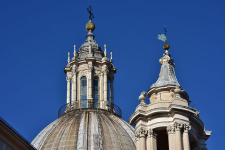 Spires, dome and roof lantern of Sant'Agnese in Agone church, in the center of Piazza Navona, designed by the famous baroque architect Borromini (17th century)の写真素材