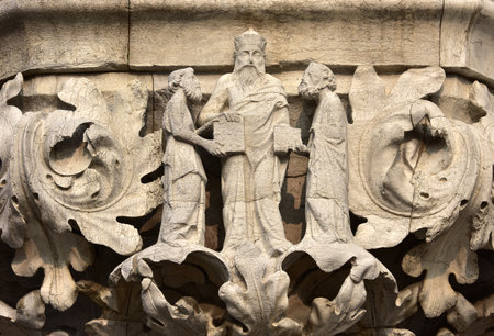 Medieval relief from Doge 'Palace in Saint Mark Square with the great greek philosopher Aristotle with His disciplesのeditorial素材