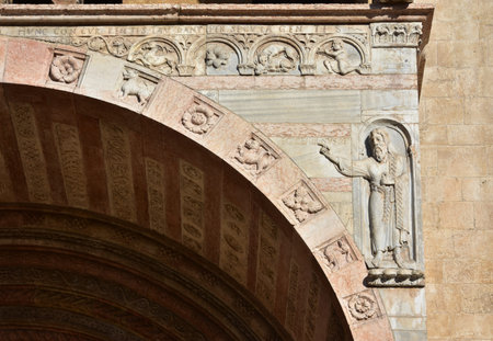 Detail from Verona Cathedral old romanesque porch with relief of John the Baptist and the inscription: "Ecce Agnus Dei" (this is the Lamb of God)の写真素材