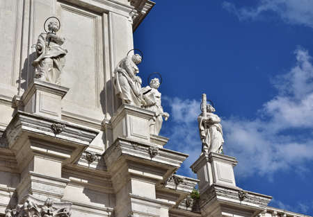 Beautiful baroque facade with saints and apostles of Santa Maria Assunta jesuit church in Venice (18th century)の写真素材