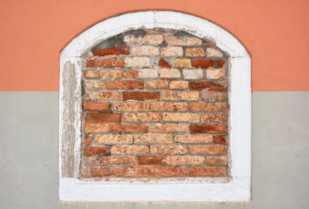 Closed window with brick wall background