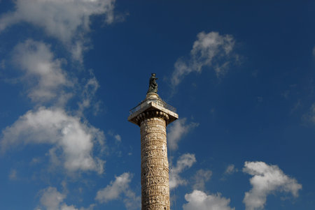 Ancient marble Column of Marcus Aurelius rise above the sky in the center of Rome, with Saint Paul bronze statue at the topの写真素材