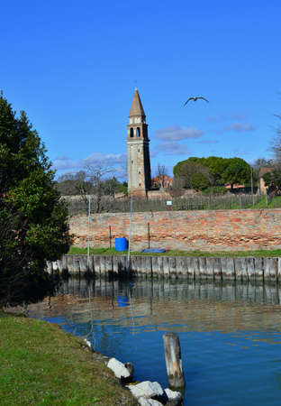 Mazzorbo Island medieval belfry with canal in Venice laggonの写真素材