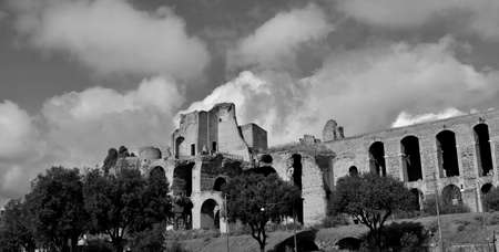 Imperial Palace ancient ruins at the top of Palatine Hill in Rome, panoramic view with beautiful clouds (Black and white)の写真素材