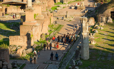 Rome, Italy, March 28, 2017: Tourists visiting Roman Forum in Roman times at sunsetのeditorial素材