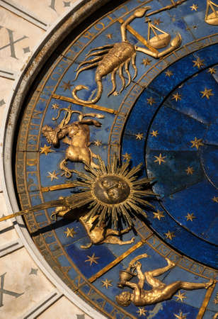Ancient time and Astrology. Detail of Saint Mark Square renaissance Clock Tower in Venice with zodiac signs, planet and stars (15th century)の写真素材