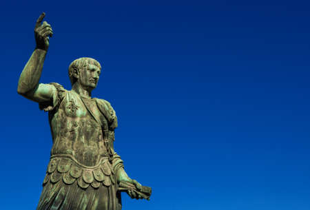 Trajan the conqueror, one of the greatest  ancient roman emperor, bronze statue along Imperial Fora avenue in the very center of Rome (with copy space)の写真素材