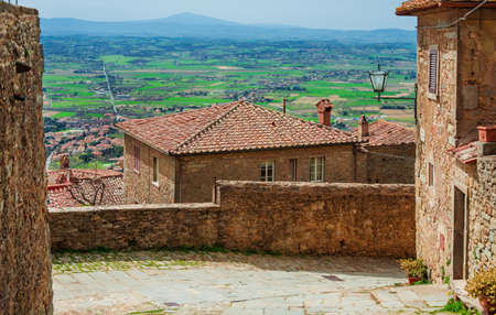 View of Val di Chiana Valley in Tuscany and Lake Trasimeno from Cortona medieval city centerの写真素材