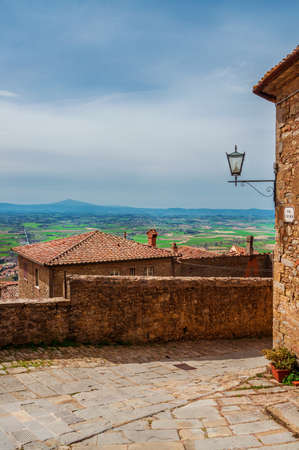 View of Val di Chiana Valley in Tuscany and Lake Trasimeno from Cortona medieval city centerの写真素材