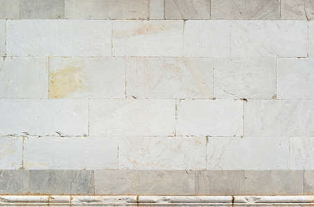 Ancient medieval white marble wall as backgroundの写真素材