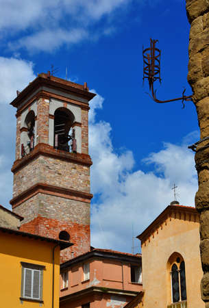 Medieval street iron torch on an ancient wall in the Lucca historic centerの写真素材