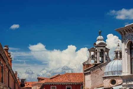 Blue sky above Rialto Market Square in Venice with old Church of San Giacomo belfry and dome (with copy space)の写真素材