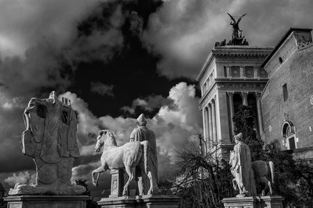 Capitoline Hill monumental balustrade with ancient roman statues and clouds in the historic center...