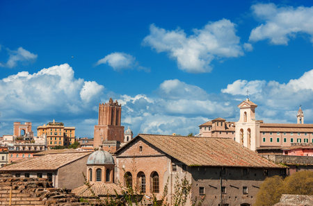 Rome historic center old skyline above Imperial Fora with medieval Tower of Militia, old churches and cloudsの写真素材
