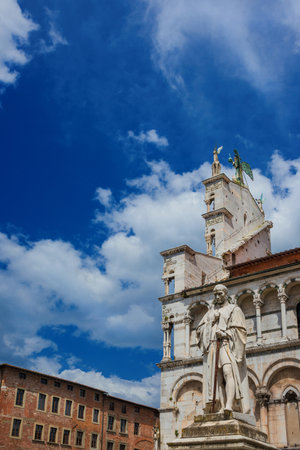 St Michael in Foro Square ancient monuments in Lucca medieval  historic center, with clouds aboveのeditorial素材
