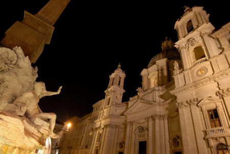 Piazza Navona Square with Fountain of Four Rivers and Saint Agnes, 17th century wonderful baroque monuments at night in Romeのeditorial素材