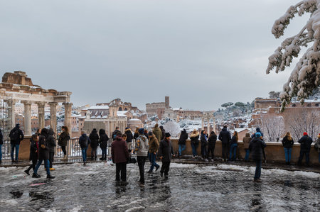 Rome, Italy, February 26, 2018: Winter in Rome. Tourists admire the wonderful and rare view of the Roman Forumのeditorial素材
