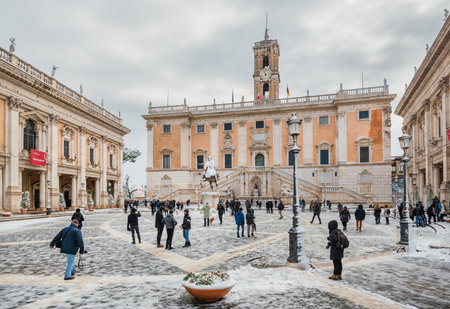 Rome, Italy, February 26, 2018: Romans and tourists visit Capitioline Square after a snowfall, a rare event in Romeのeditorial素材