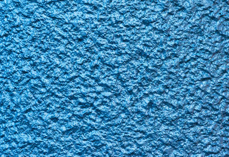 Blue concrete wall with rough surface as backgroundの写真素材