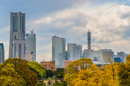 Yokohama, Japan, April 2, 2019: View of Minato Mirai skyscrapers and attractions from Yamashita Park on a dull day. A major center for business, shopping, and tourism in the city of Yokohamaのeditorial素材