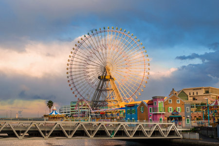 Yokohama, Japan, April 2, 2019: Cosmo World amusement park with Cosmo Clock 21 in Yokohama at sunset, one of the tallest ferries wheel in worldのeditorial素材
