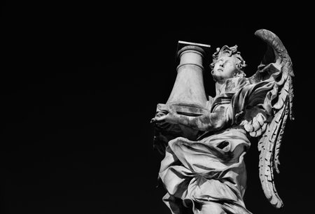 Angel statue holding the Column of Jesus Passion looks at the Heaven A 17th century baroque masterpiece at the top of Sant'Angelo Bridge in the center of Rome (Black and White with copy space)のeditorial素材