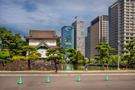Tradition and Modernity in Japan. View of Imperial Palace old tower with the modern buildings side by side in central Tokyoのeditorial素材