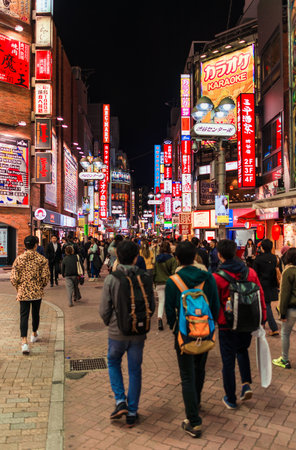 Tokyo city lights. People walking along the streets of  the famous entertainment district of Shibuyaのeditorial素材