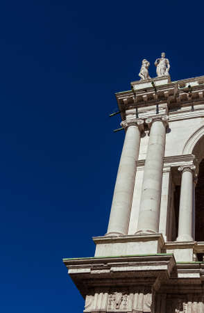 Basilica Palladiana corner with columns and statues (16th-17th century) in Vicenza, designed by the famous renaissance architect Andrea Palladio (with blue sky and copy space)の写真素材