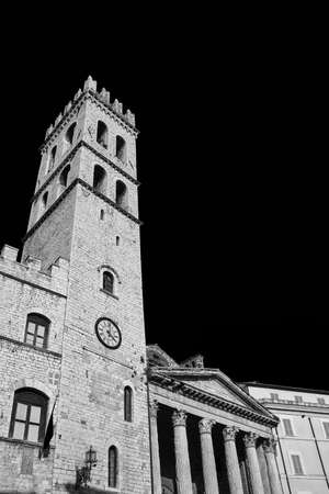 Medieval People's Tower and ancient roman Temple of Minerva in Assisi Communal Square (Black and White with copy space)の写真素材