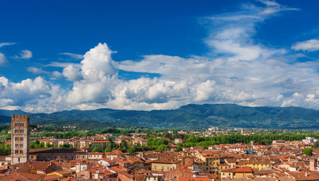 Lucca old  historic center skyline with medieval tower, amphitheater Square and cloudsのeditorial素材