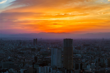 Sunset view of city endless suburbs of Meguro, Setagaya and Kawasaki wrapped in evening mist, from Ebisuのeditorial素材