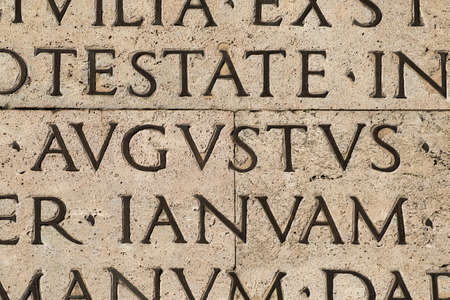 Latin ancient language. Inscription from the famous Res Gestae (1st century AD), with the word Augustus in the centerの写真素材