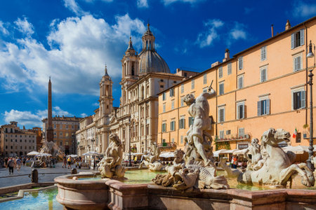 Tourists visit the famous Piazza Navona Square with its beautiful baroque church and fountainsのeditorial素材