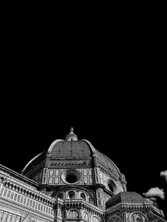 St Mary of the Flower iconic dome in Florence seen from below, built by italian architect Brunelleschi in the 15th century and symbol of Renaissance in the world (Black and White with copy space above)の写真素材