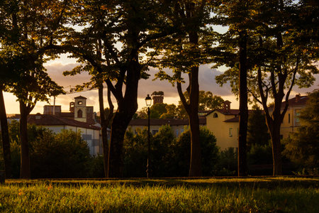 Sunset in Lucca. View of Lucca medieval towers from ancient walls parkの写真素材