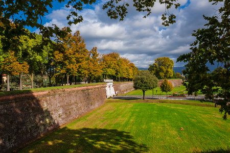 The Walls of Lucca public park. Porta Elisa (Elisa's Gate) with autumnal leavesの写真素材