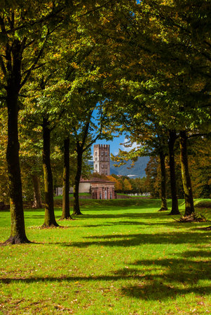 The Walls of Lucca public park with St Mary Gate and St Frediano medieval bell tower seen from St Martino Bulwarkのeditorial素材
