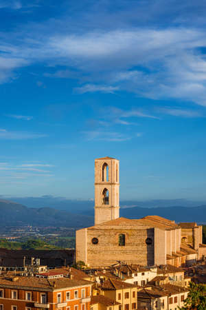 View of Perugia huge and iconic St Dominic Basilica and Umbria countryside in the backgroundの写真素材