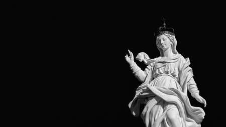 Statue of Virgin Mary of the Stars at the top of an ancient column in the historic center of Lucca, erected in 1687 (Black and White with copy space)の写真素材