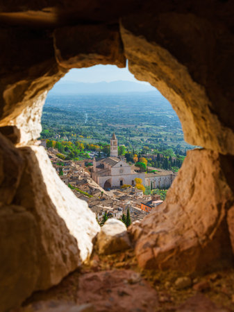 ASSISI, ITALY - OCTOBER 23, 2019: View of Assisi beautiful historical center with medieval Basilica of Saint Clare from Rocca Maggiore ruined wallsのeditorial素材