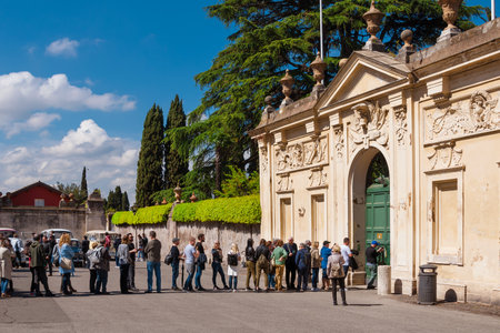 ROME, ITALY - APRIL 12, 2019: Tourism in Rome. People waiting to get a view of Saint Peter's Basilica through the keyhole of Magistral Villa of Malta on Aventine Hillのeditorial素材