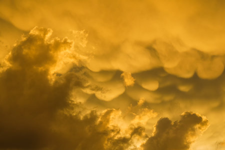 Sunset golden sky with clouds as backgroundの写真素材