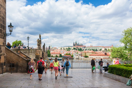 PRAGUE, CZECH REPUBLIC - JULY 15, 2022: Tourism in Prague.Crusaders' Square with view towards the famous Charles Bridge, the Vltava River and Prague Castleのeditorial素材