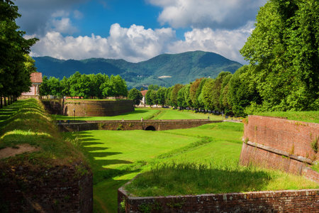 Lucca city walls beautiful park with Mount Pisano from Santa Croce (St Cross) Bulwarkの写真素材