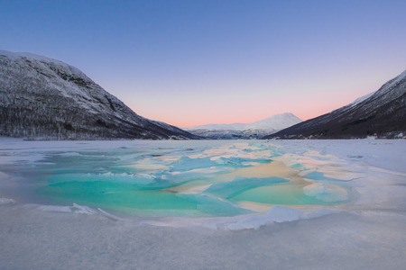 Beautiful frozen fjord with fogの写真素材