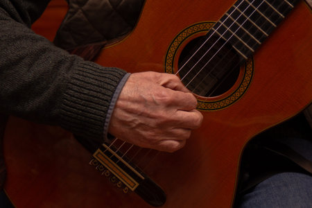 Man playing an acoustic guitar